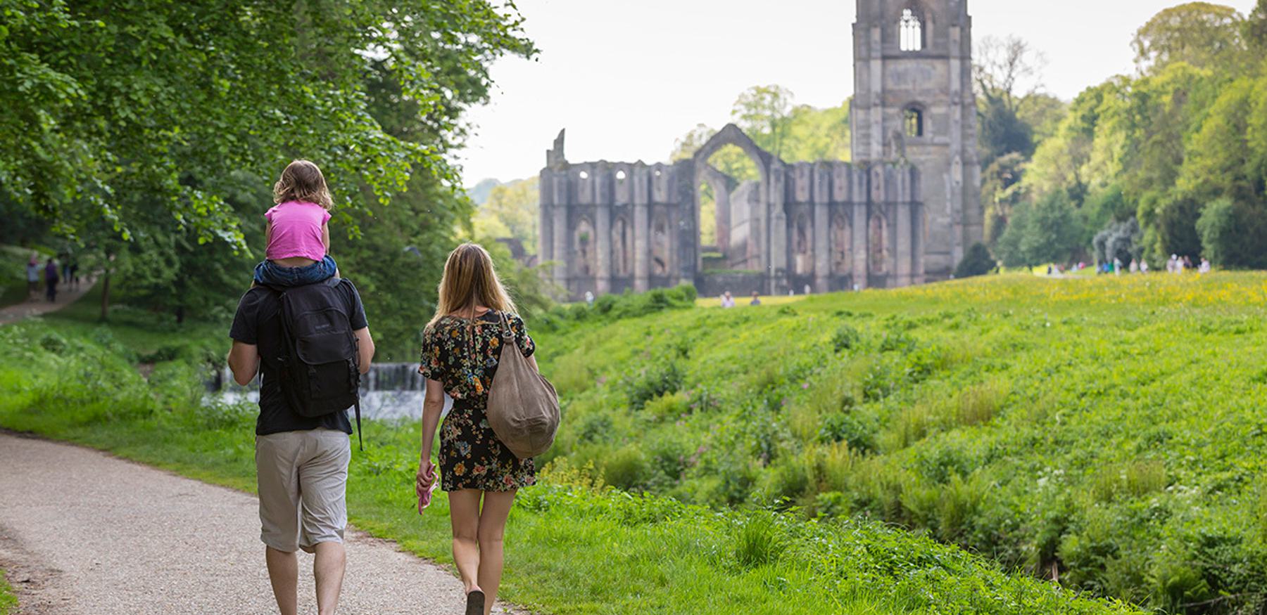 Fountains Abbey with a family